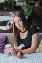 Woman drinking coffee in the morning at restaurant soft focus. pretty girl with cup of cappuccino. lady enjoy Royalty Free Stock Photo