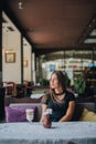 Woman drinking coffee in the morning at restaurant soft focus. Smiling pretty girl with cup of cappuccino. lady enjoy Royalty Free Stock Photo