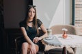 Woman drinking coffee in the morning at restaurant soft focus. Smiling pretty girl with cup of cappuccino. lady enjoy Royalty Free Stock Photo