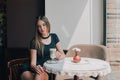 Woman drinking coffee in the morning at restaurant soft focus. Smiling pretty girl with cup of cappuccino. lady enjoy Royalty Free Stock Photo