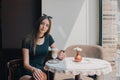 Woman drinking coffee in the morning at restaurant soft focus. Smiling pretty girl with cup of cappuccino. lady enjoy Royalty Free Stock Photo