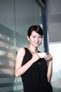 Woman drinking coffee at office Royalty Free Stock Photo