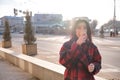 Woman drinking coffee in the sun, outdoor in sunlight light, enjoying her morning coffee. Royalty Free Stock Photo