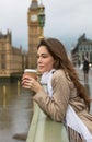 Woman Drinking Coffee on Westminster Bridge, Big Ben, London Royalty Free Stock Photo