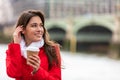 Woman Drinking Coffee by Westminster Bridge, London, England Royalty Free Stock Photo