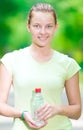 Woman drinking cold mineral water from a bottle after fitness ex Royalty Free Stock Photo