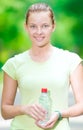 Woman drinking cold mineral water from a bottle after fitness ex Royalty Free Stock Photo