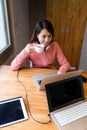 Woman drinking a cup of tea and using the laptop computer Royalty Free Stock Photo