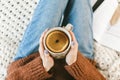 Woman drinking a cup of warm herbal orange tea Royalty Free Stock Photo