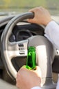 Woman drinking while driving Royalty Free Stock Photo