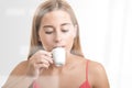 Woman Drinking an Espresso At a Coffee Shop Royalty Free Stock Photo