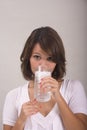 Woman drinking a glass of ice water