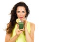 Woman drinking a green smoothie. Royalty Free Stock Photo