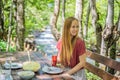 Woman drinking healthy fruits and vegetables juice smoothie in summer. Happy girl enjoying organic drink Portrait of a Royalty Free Stock Photo