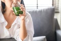 Woman drinking healthy green detox juice Royalty Free Stock Photo