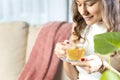 Woman drinking herb tea