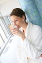 Woman drinking hot tea relaxing in a spa center Royalty Free Stock Photo