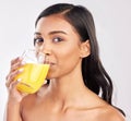 Woman, drinking juice and health with nutrition and portrait, healthy drink and diet on studio background. Weight loss Royalty Free Stock Photo