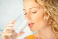 Woman drinking mineral water Royalty Free Stock Photo