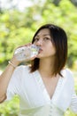 Woman drinking mineral water Royalty Free Stock Photo