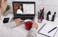 Woman drinking morning coffee in red cup, learning English online Royalty Free Stock Photo