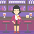 Woman drinking orange cocktail at the bar. Royalty Free Stock Photo