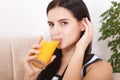 Woman drinking orange juice Beautiful mixed-race Asian, Caucasian model. Royalty Free Stock Photo