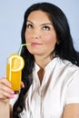 Woman drinking orange juice and dream Royalty Free Stock Photo