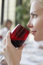 Woman Drinking Red Wine At Dinner Party Royalty Free Stock Photo