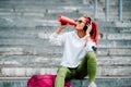 Woman drinking sports nutrition beverage while working out Royalty Free Stock Photo