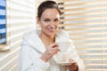 Woman drinking tea after treatment Royalty Free Stock Photo