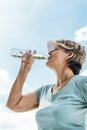 Woman Drinking Water After Exercise Concept