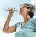 Woman Drinking Water After Exercise Concept