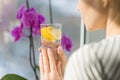 Woman drinking water with fresh organic lemon. Royalty Free Stock Photo