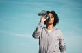 Woman, drinking water and health with fitness, hydration and workout outdoor. Plastic bottle, liquid and wellness with Royalty Free Stock Photo