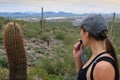 Woman Drinking Water While Looking At Arizona Desert Near Phoenix Scottsdale