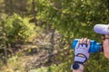 Woman drinking water from sport water bottle. Bike riding pause. Active lifestyle concept. Royalty Free Stock Photo