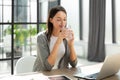 Woman drinking water after taking medicine in the office Royalty Free Stock Photo