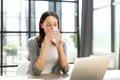 Woman drinking water after taking medicine in the office Royalty Free Stock Photo
