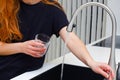 Woman drinking from water tap or faucet in kitchen. Pouring fresh drink. Healthy lifestyle. Water quality check concept. The Royalty Free Stock Photo