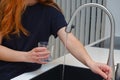 Woman drinking from water tap or faucet in kitchen. Pouring fresh water. Healthy lifestyle. Water quality check concept. The Royalty Free Stock Photo