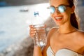 Woman drinking water from transparent bottle on Royalty Free Stock Photo