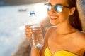 Woman drinking water from transparent bottle on Royalty Free Stock Photo