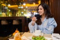 Woman drinking wine in the restaurant Royalty Free Stock Photo