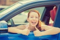 Woman driver happy smiling showing thumbs up sitting inside new car Royalty Free Stock Photo