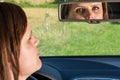 Woman driver looking in the rear-view mirror Royalty Free Stock Photo