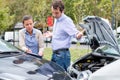 Woman driver and angry man arguing about the damage of the car Royalty Free Stock Photo