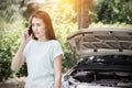 Woman driver on the phone for car breakdown