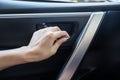 Woman driver pressing button locking and unlocking doors Royalty Free Stock Photo