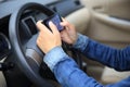 Woman driver use cell phone driving car Royalty Free Stock Photo